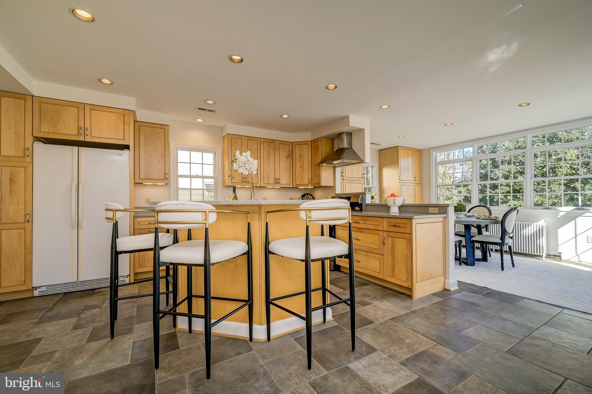 7817 Stratford Road Bethesda, MD 20814 - Photo 11 of 38 a kitchen with appliances cabinets and chair
