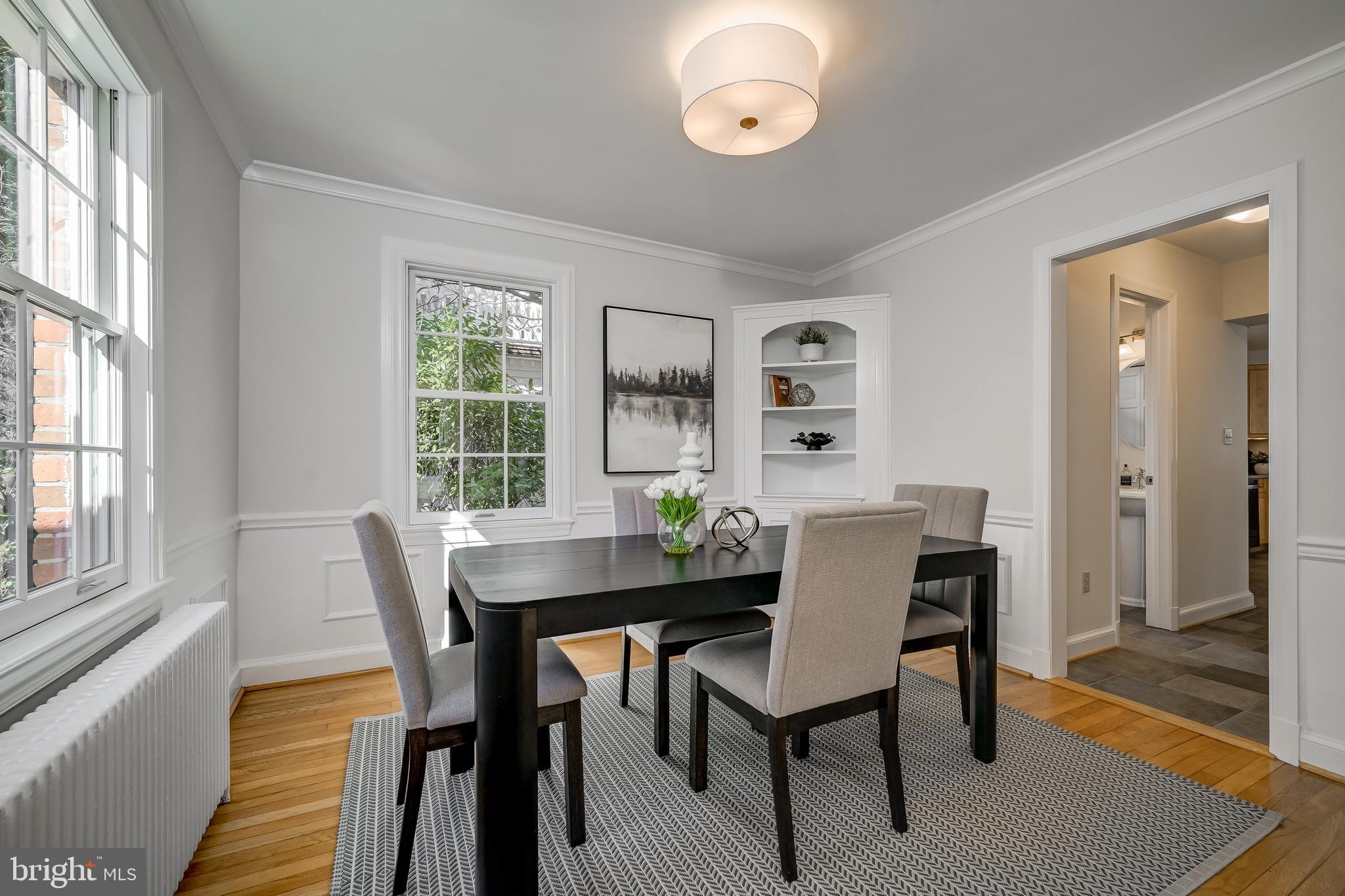 7817 Stratford Road Bethesda, MD 20814 - Photo 18 of 38 a view of a dining room with furniture and wooden floor