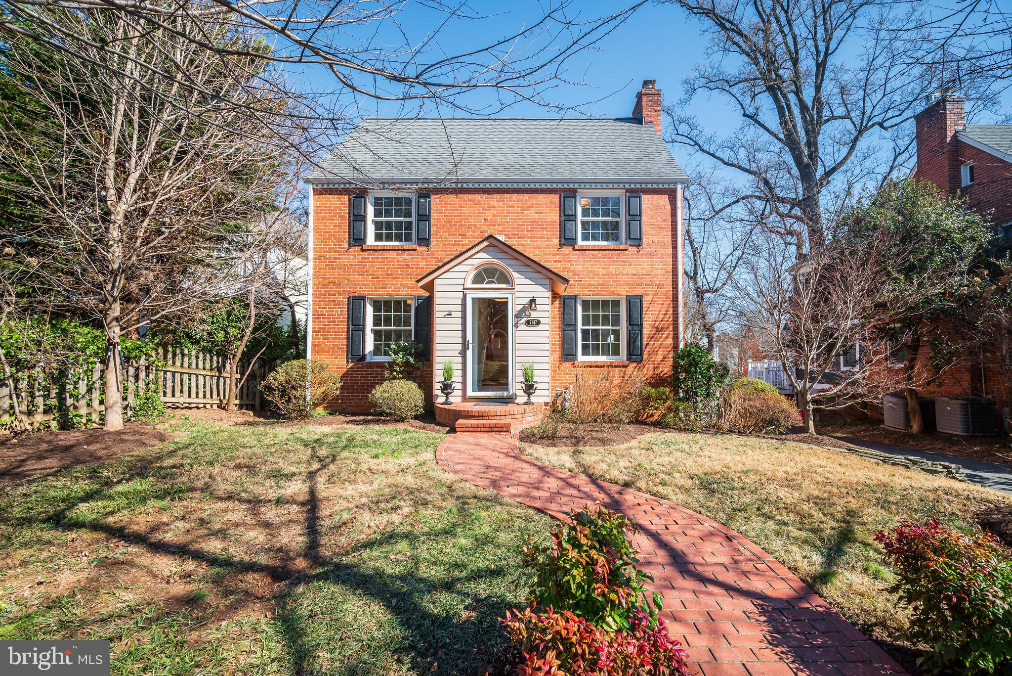 7817 Stratford Road Bethesda, MD 20814 - Photo 2 of 38 a front view of a house with a yard