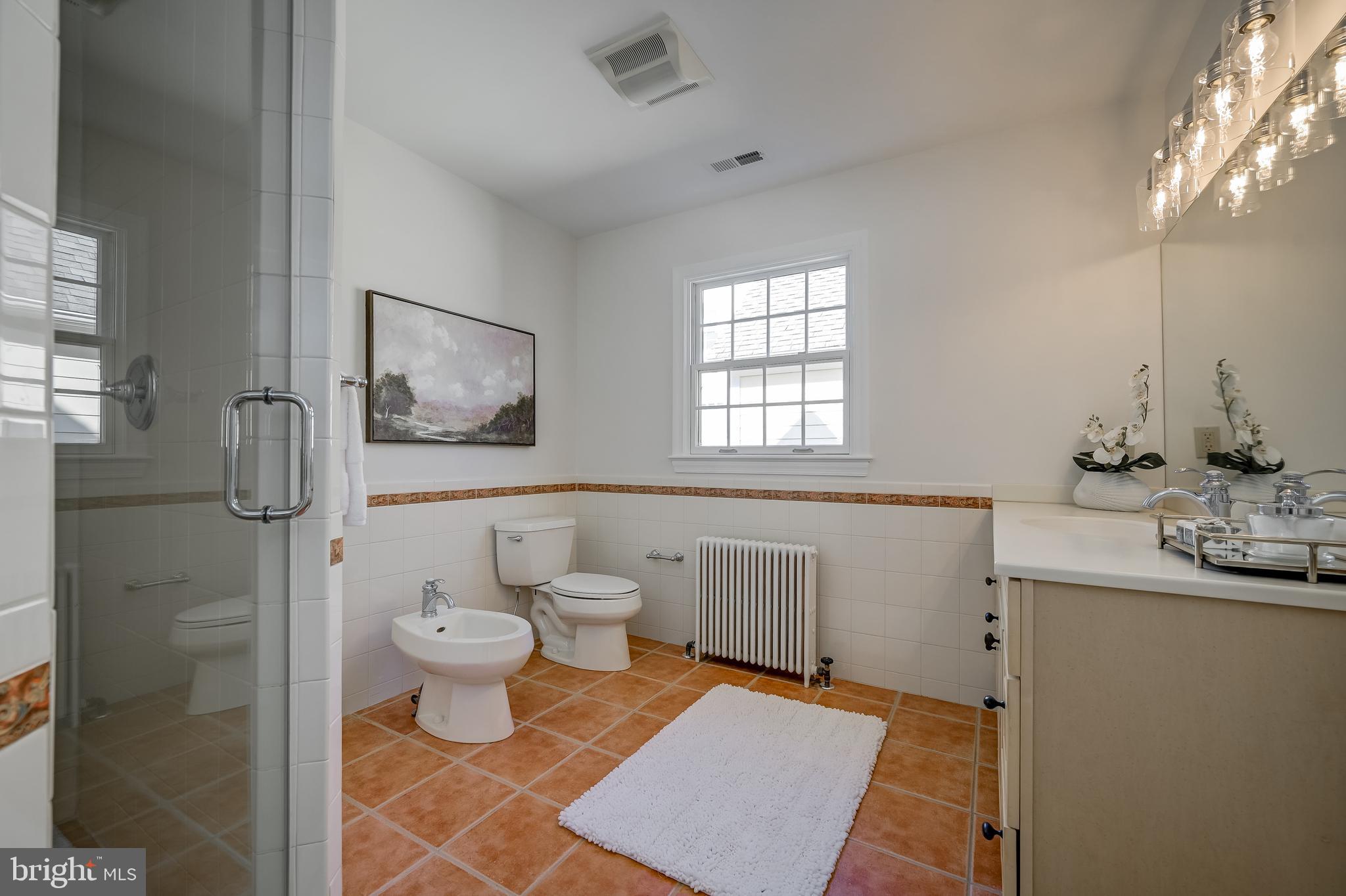 7817 Stratford Road Bethesda, MD 20814 - Photo 23 of 38 a bathroom with a sink toilet and shower