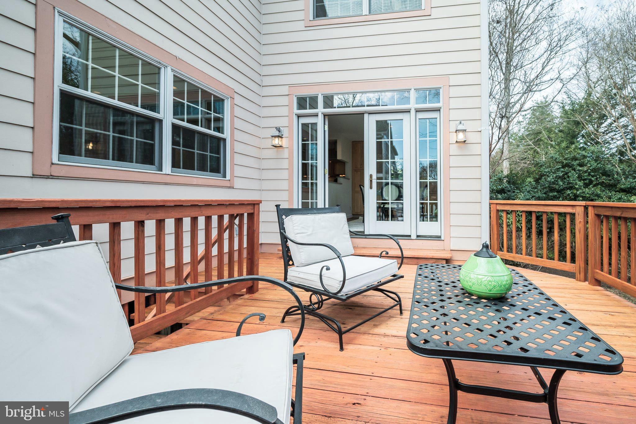 7817 Stratford Road Bethesda, MD 20814 - Photo 35 of 38 a balcony with table and chairs