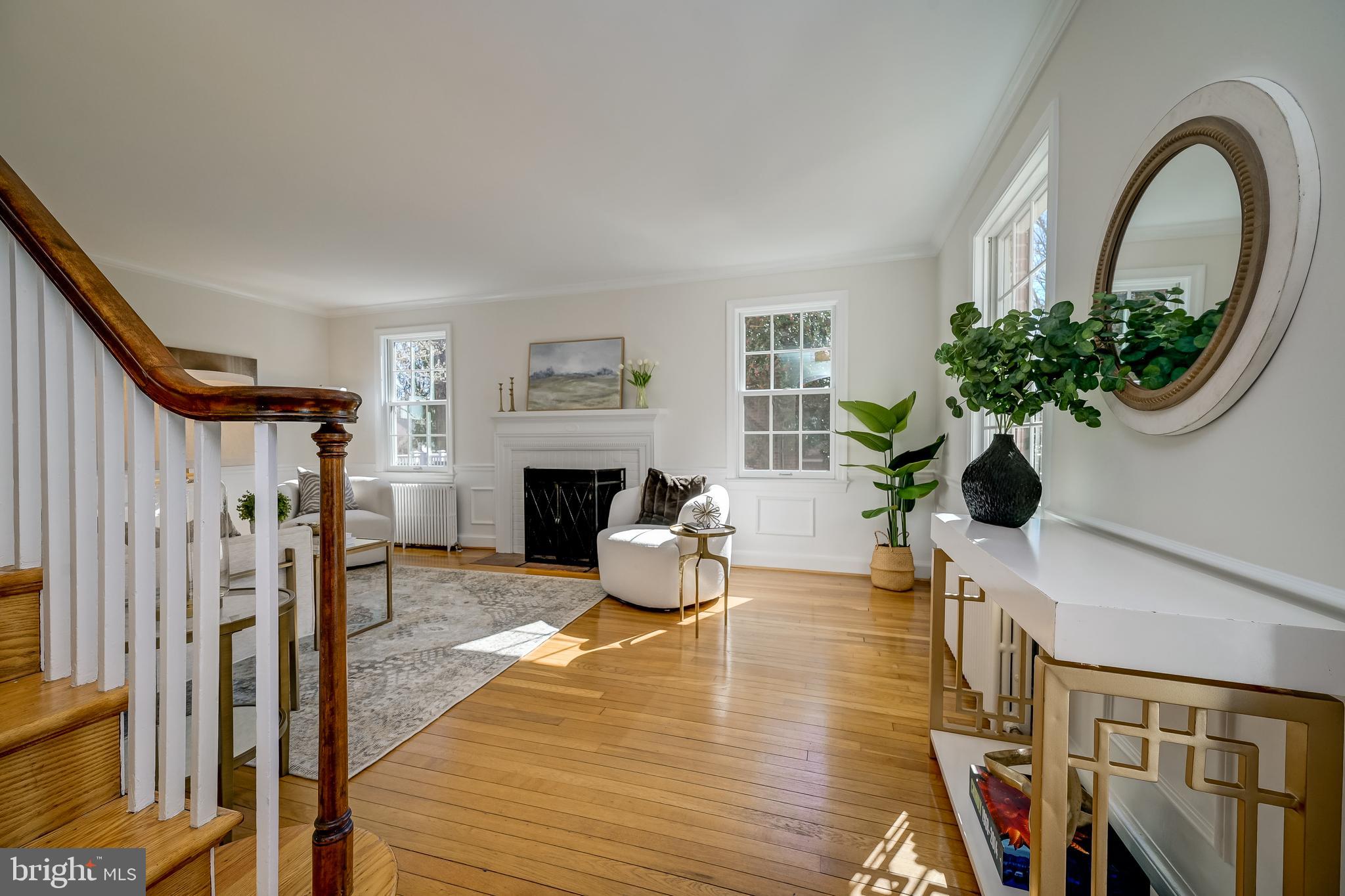 7817 Stratford Road Bethesda, MD 20814 - Photo 5 of 38 a living room with furniture fireplace and wooden floor