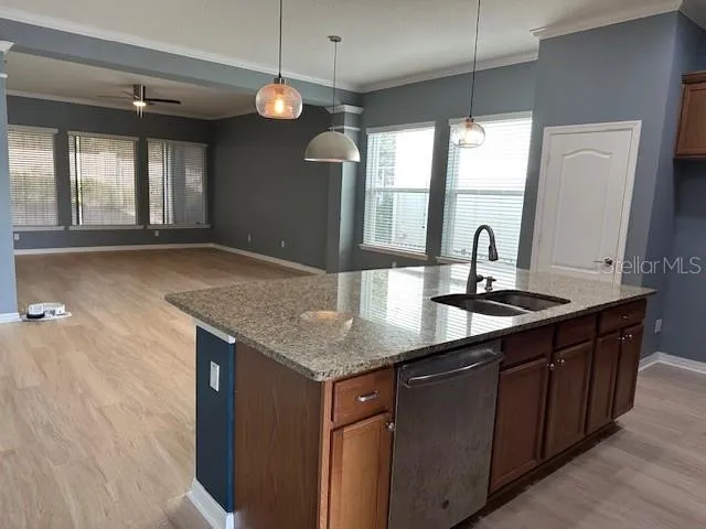 a kitchen with a sink and large window