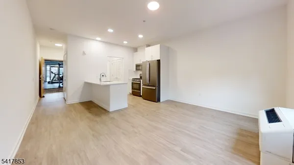 a view of a hallway with a living room