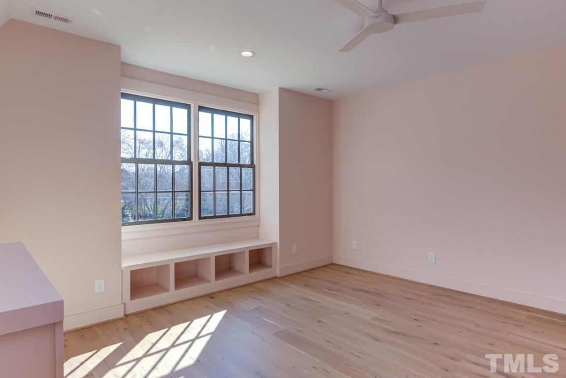 612 Shelley Road Raleigh, NC 27609 - Photo 13 of 19 wooden floor in an empty room with a window