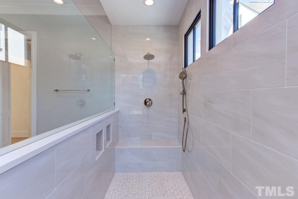 612 Shelley Road Raleigh, NC 27609 - Photo 5 of 19 a bathroom with a bathtub and shower