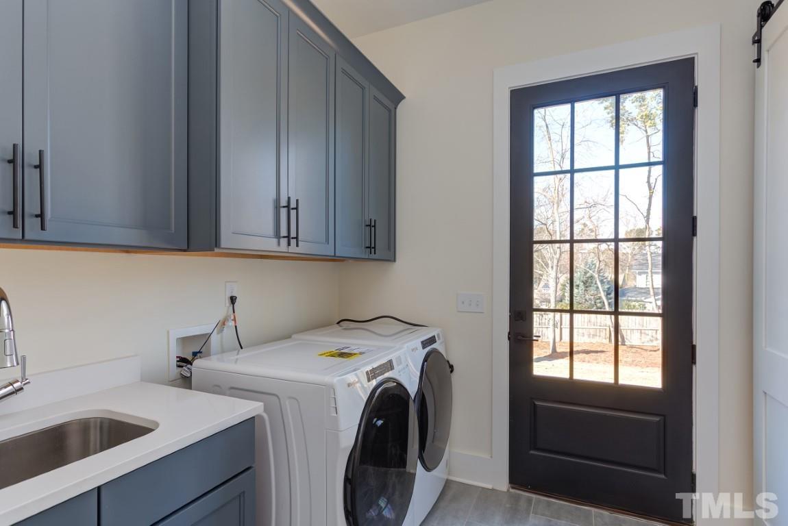 612 Shelley Road Raleigh, NC 27609 - Photo 9 of 19 a utility room with dryer and washer