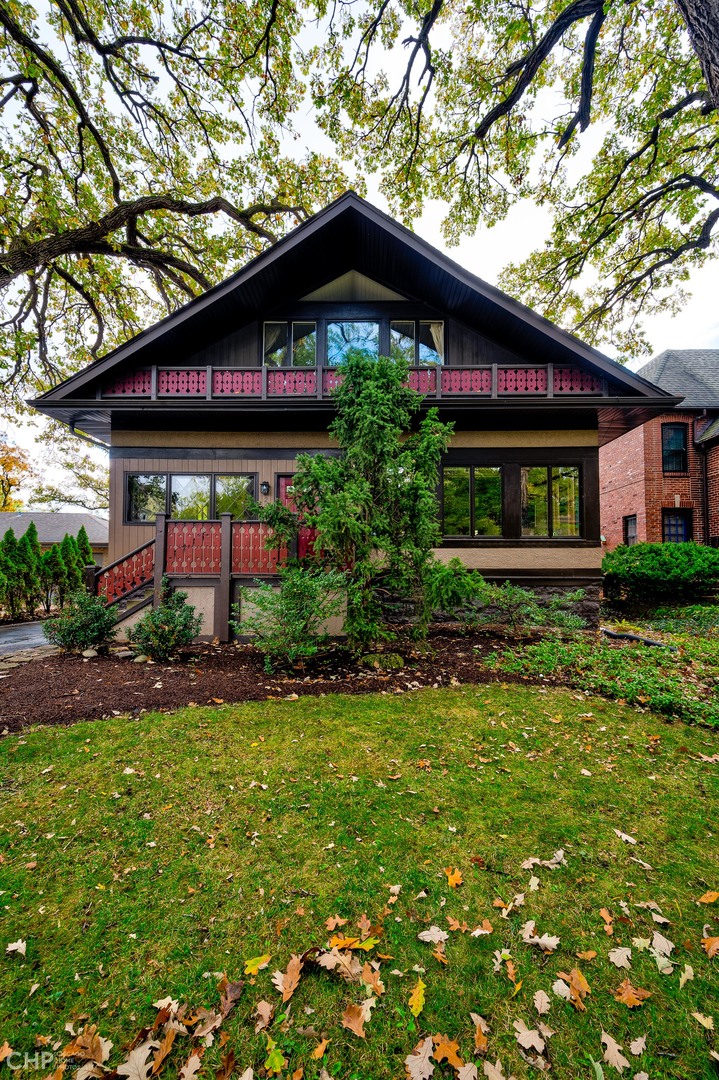 259 Scottswood Road Riverside, IL 60546 - Photo 2 of 5 a front view of a house with a garden