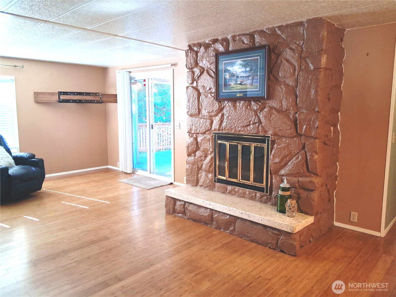 815 124th Street Southwest, Unit 36 Everett, WA 98204 - Photo 19 of 32 a living room with hard wood floors and a fireplace