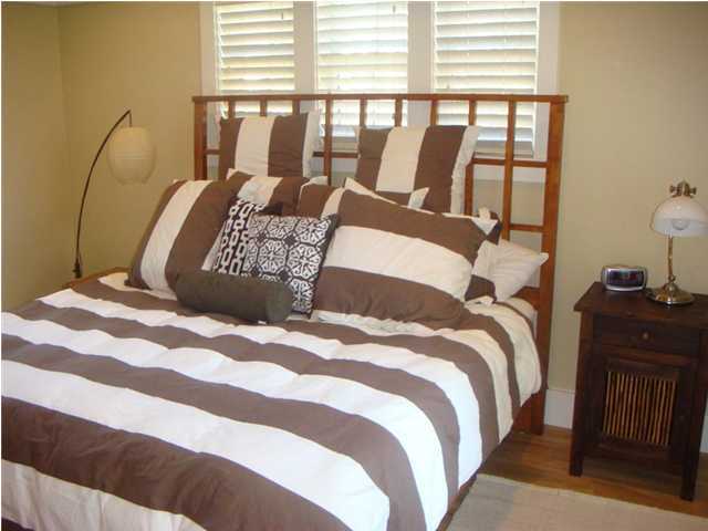 6 Mistflower Lane Santa Rosa Beach, FL 32459 - Photo 9 of 11 a bedroom with a bed and wooden floor