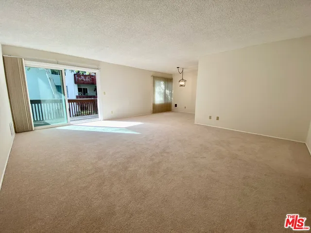 a view of a balcony with wooden floor