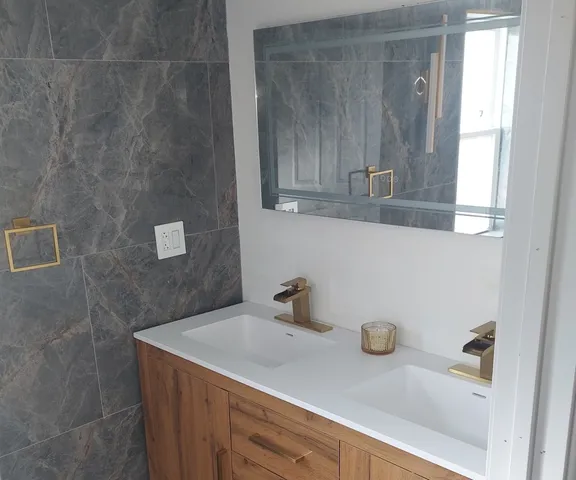 a bathroom with a sink and cabinets