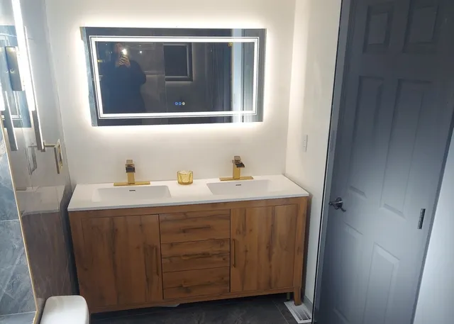 a bathroom with a sink and a mirror