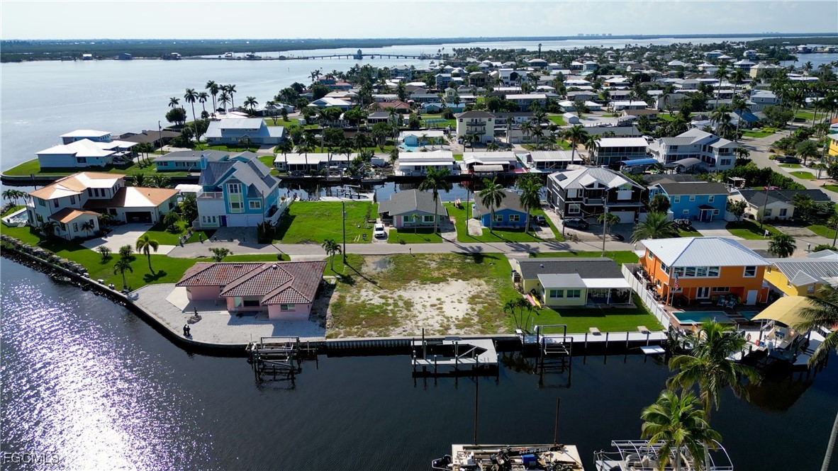 2864 Triggerfish Street Matlacha, FL 33993 - Photo 8 of 10 an aerial view of a houses with a swimming pool outdoor seating and yard