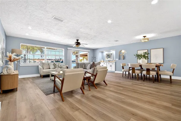 a bed room with a bed and a chandelier