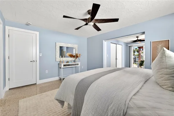 a living room with furniture potted plant and a window