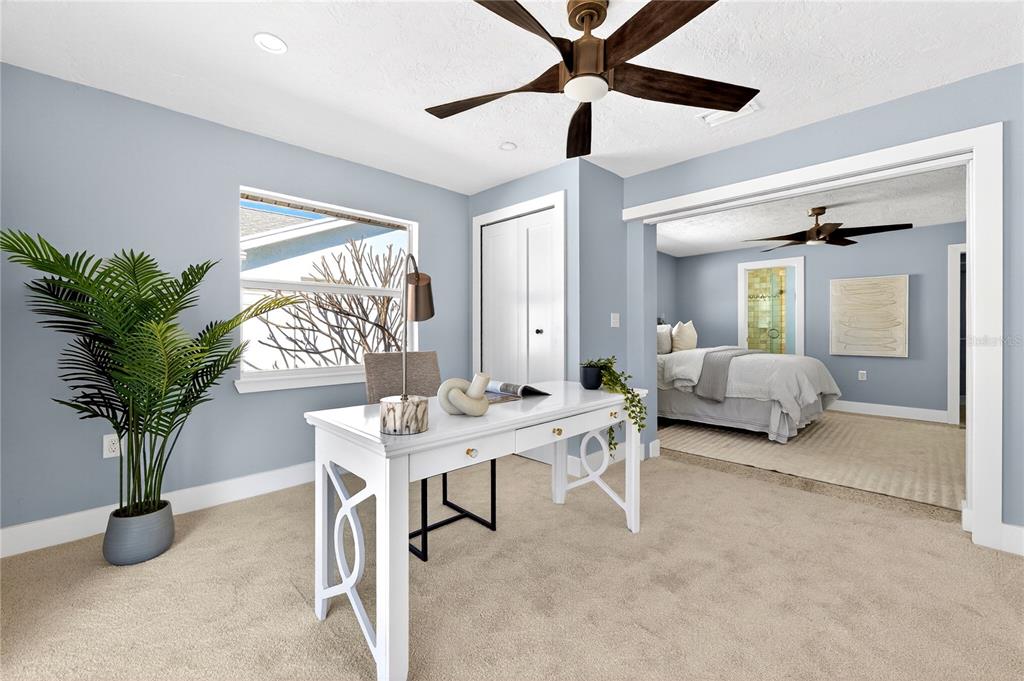 6410 3rd Palm Point St. Pete Beach, FL 33706 - Photo 20 of 71 a living room with furniture and a potted plant