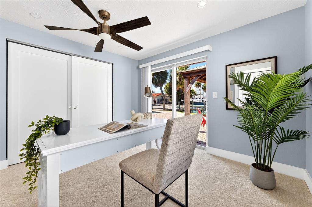 6410 3rd Palm Point St. Pete Beach, FL 33706 - Photo 21 of 71 a living room with furniture potted plant and a window