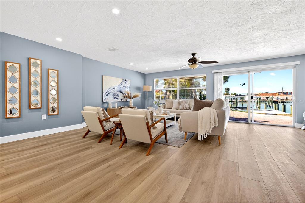 6410 3rd Palm Point St. Pete Beach, FL 33706 - Photo 24 of 71 a living room with furniture and a large window