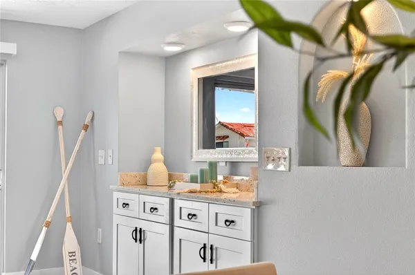 a view of a lake with boats and trees in the background