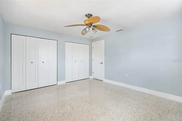 a front view of a house with a garden and yard