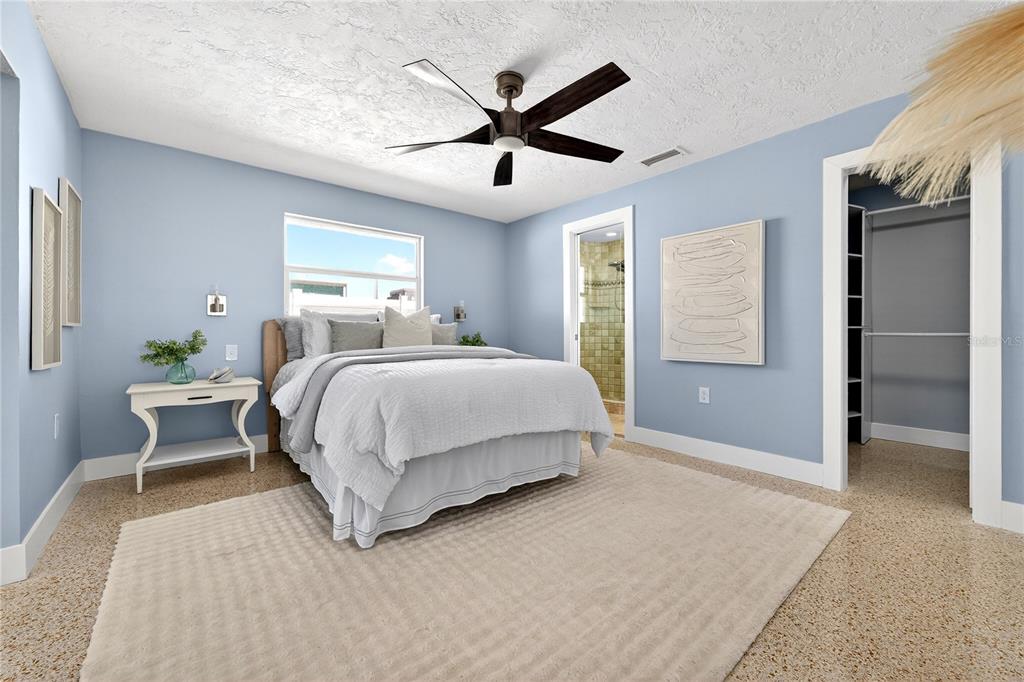 6410 3rd Palm Point St. Pete Beach, FL 33706 - Photo 54 of 71 a bedroom with a bed and window