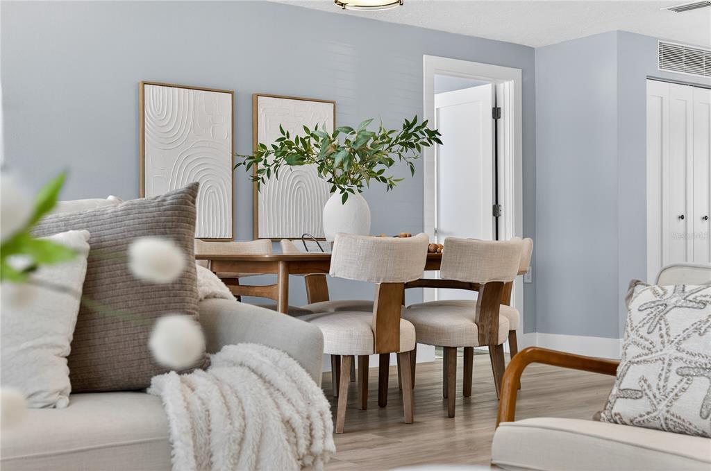 6410 3rd Palm Point St. Pete Beach, FL 33706 - Photo 63 of 71 a living room with furniture flowerpot and wooden floor