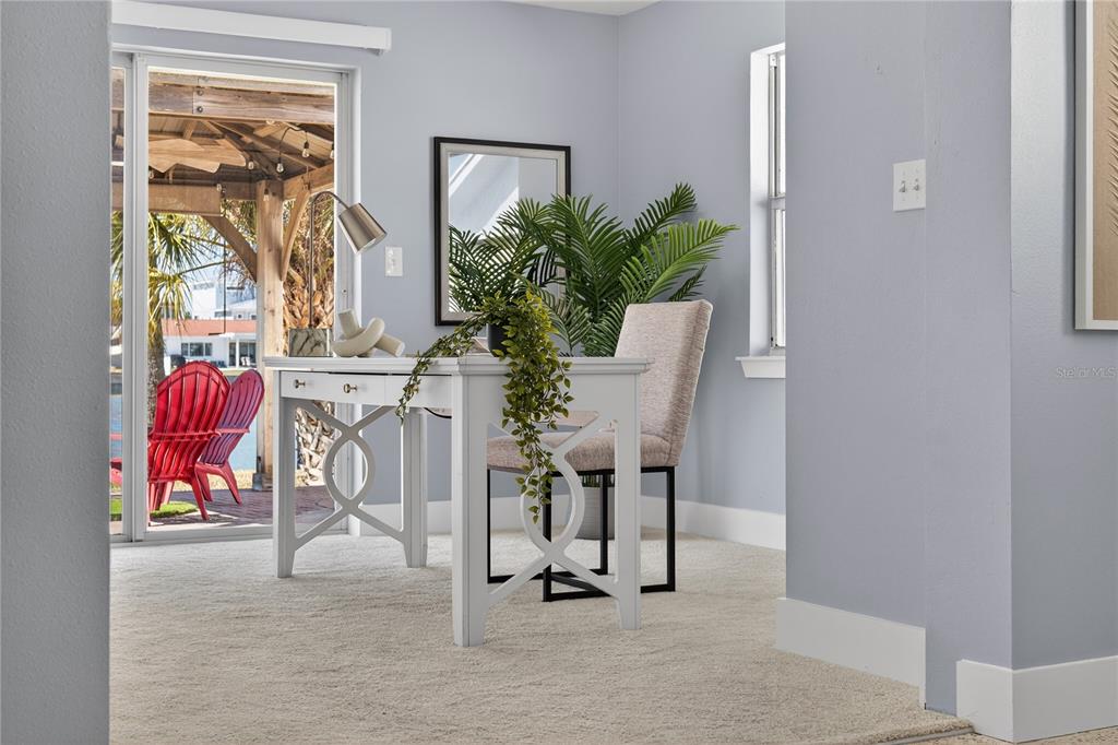 6410 3rd Palm Point St. Pete Beach, FL 33706 - Photo 69 of 71 a view of a livingroom with furniture and a potted plant