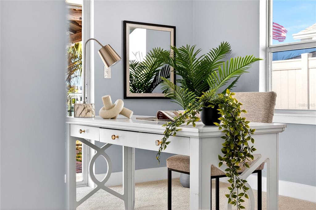 6410 3rd Palm Point St. Pete Beach, FL 33706 - Photo 70 of 71 a vase of flowers sitting on a table with a kitchen