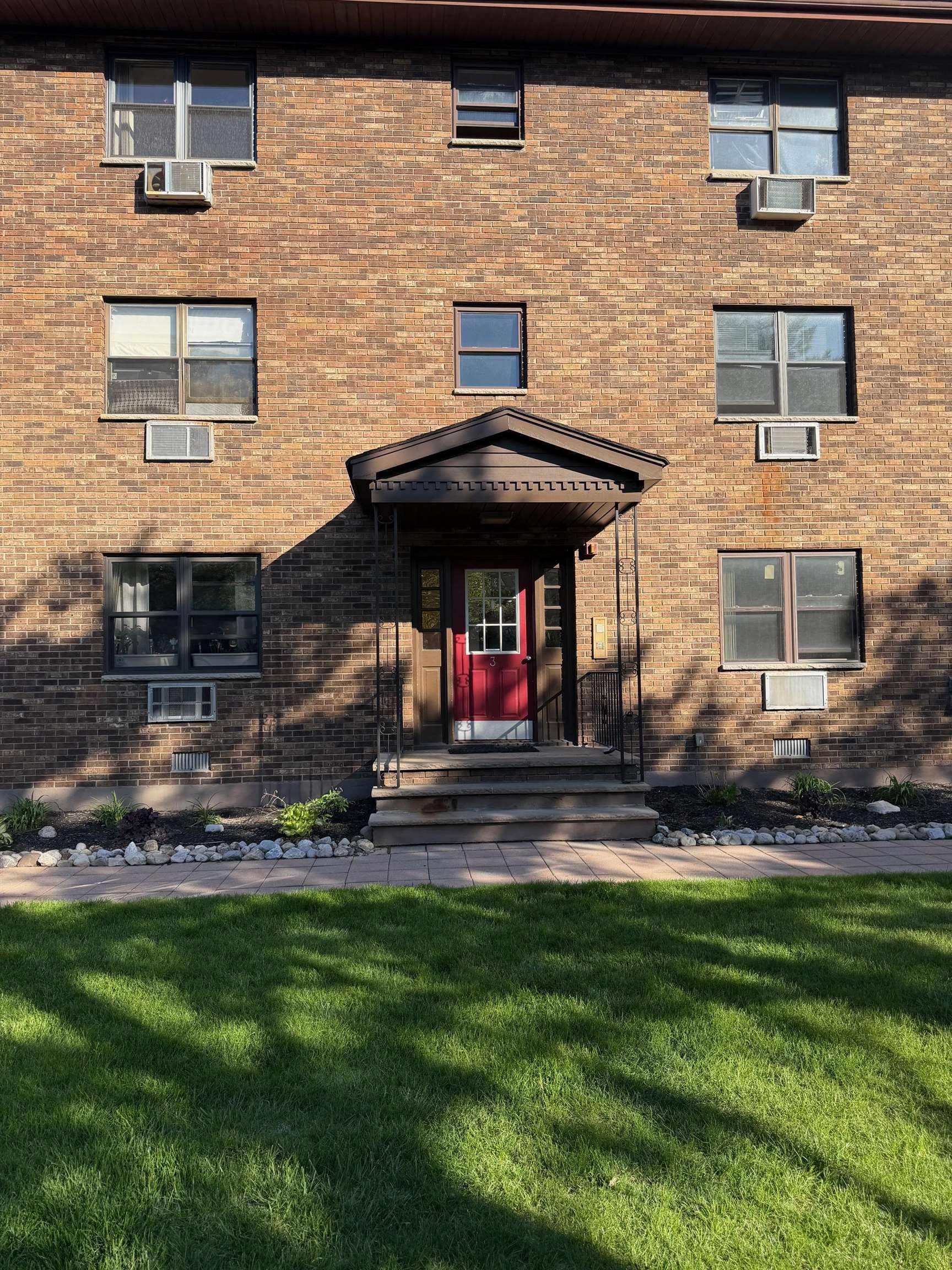 729 10th Street, Unit 3D Secaucus, NJ 07094 - Photo 1 of 7 a view of a house with a yard