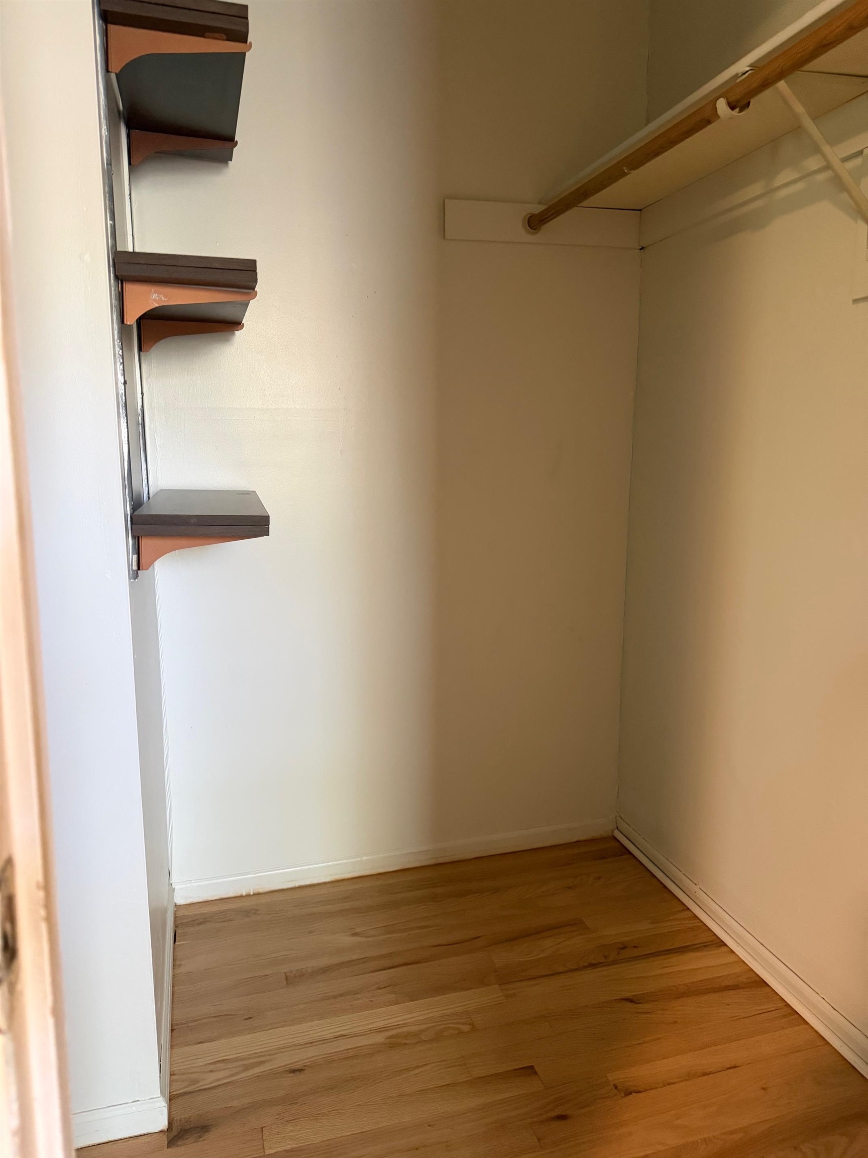 729 10th Street, Unit 3D Secaucus, NJ 07094 - Photo 6 of 7 a view of a room with wooden floor and white walls