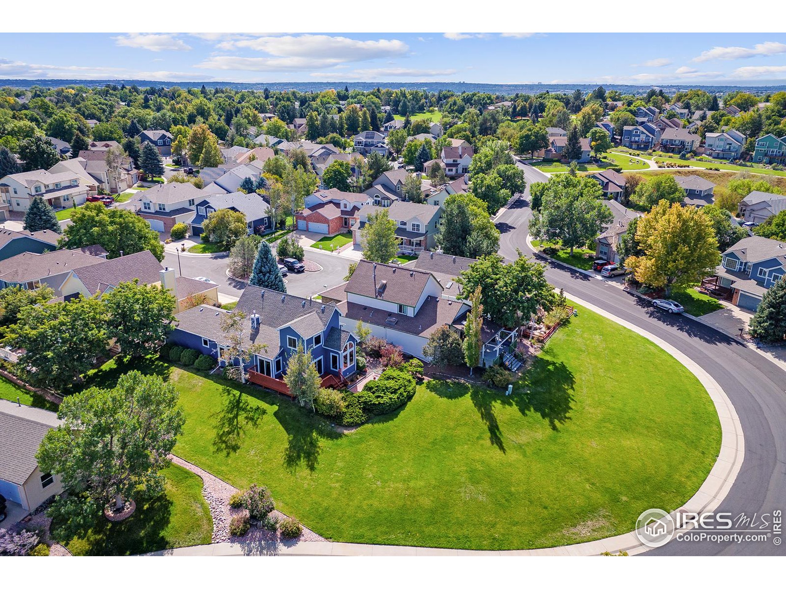 147 Keystone Trail Broomfield, CO 80020 - Photo 16 of 20 an aerial view of a house with a garden and lake view