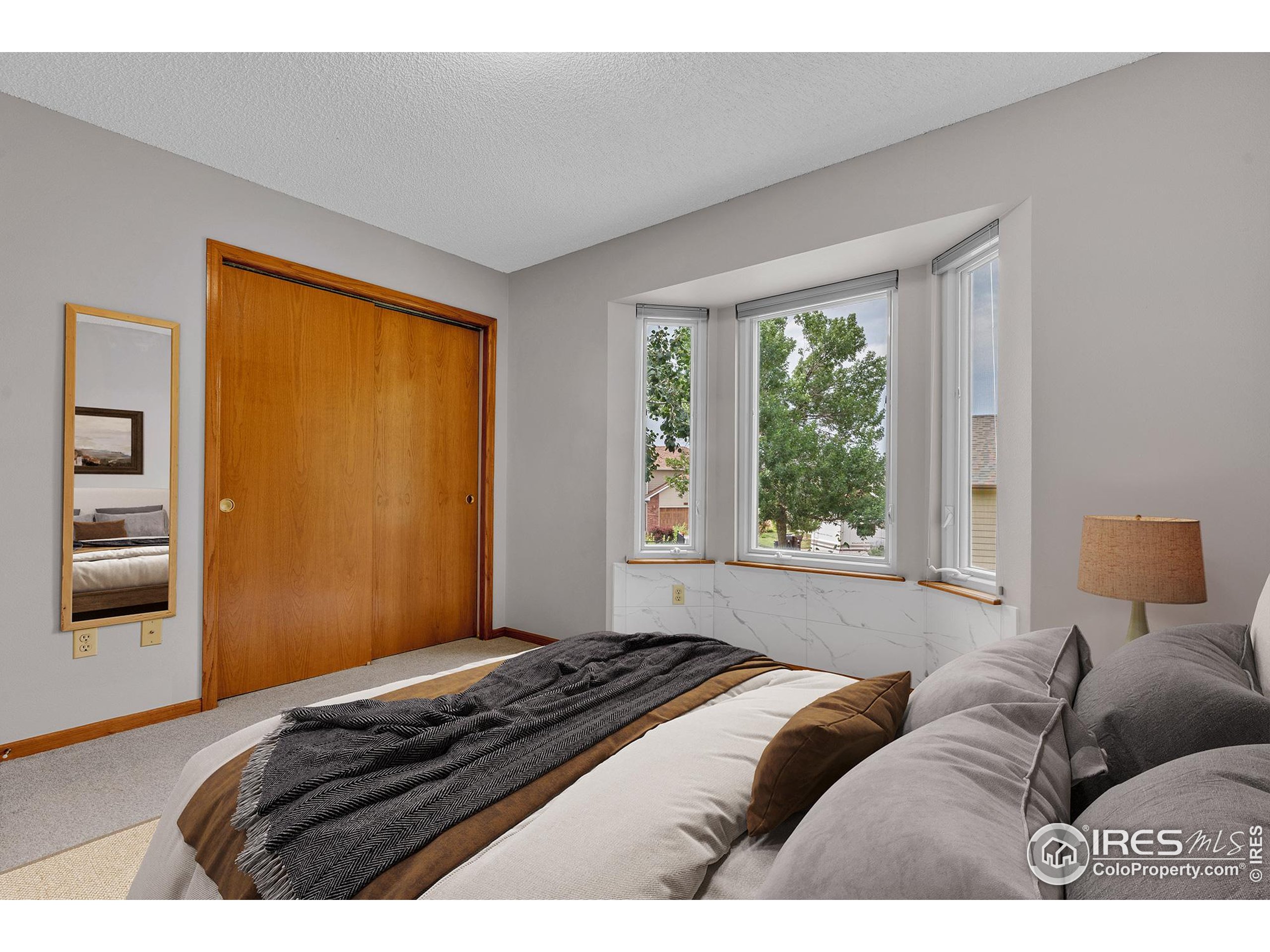 147 Keystone Trail Broomfield, CO 80020 - Photo 9 of 20 a bedroom with bed and a window