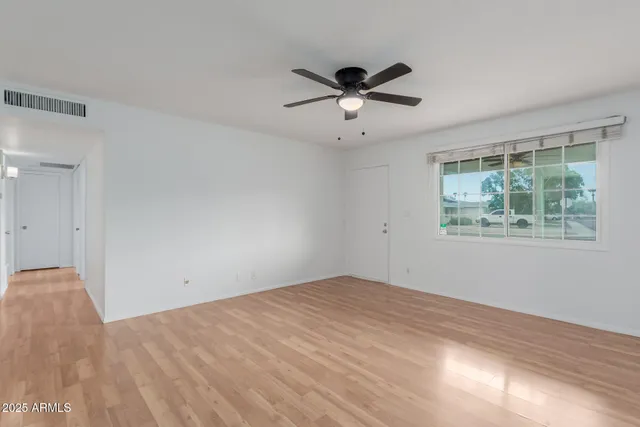 a view of an empty room with a window