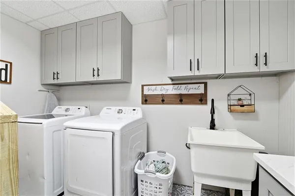 a utility room with dryer and washer