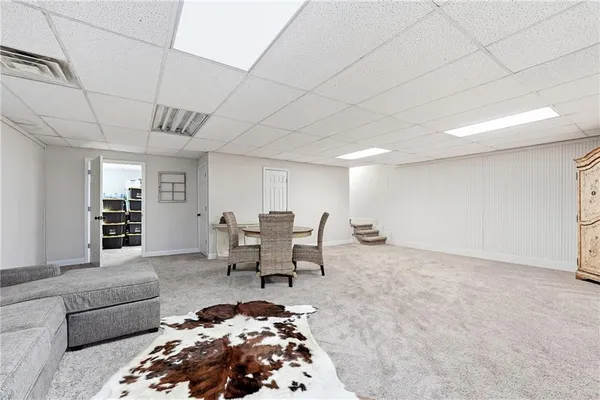 a living room with furniture and a rug