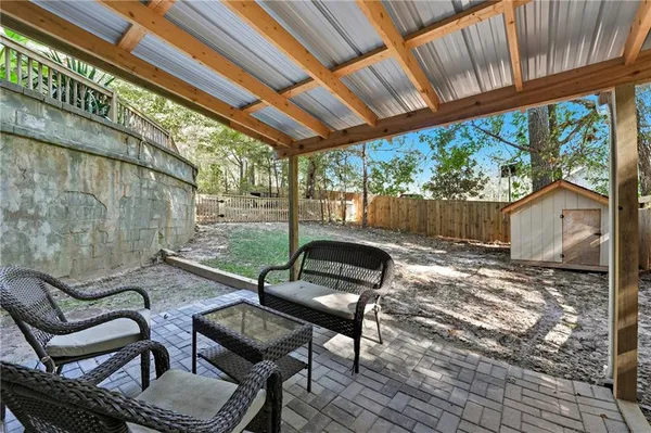 a view of a chairs and table in the patio