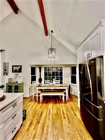 a view of kitchen with furniture and wooden floor