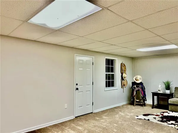 a view of livingroom with furniture and gym equipment