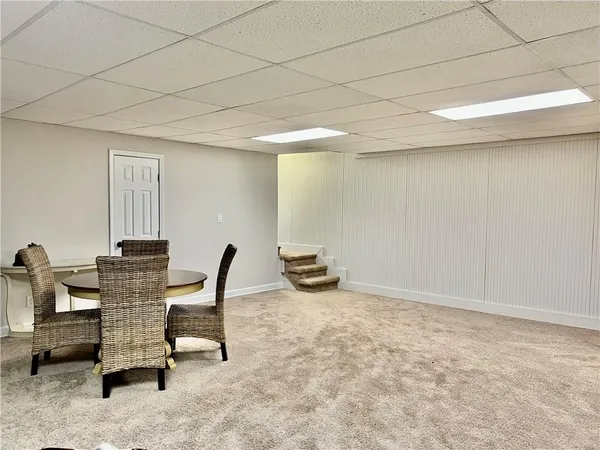 a view of a workspace with furniture