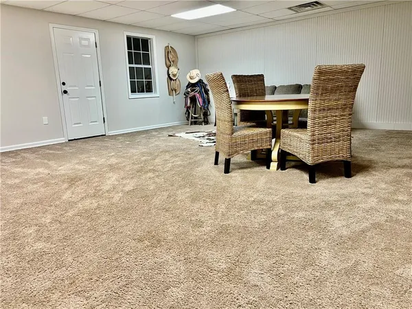 a view of work space with furniture and window