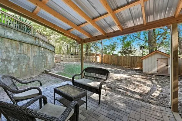 a view of a chairs and table in the patio