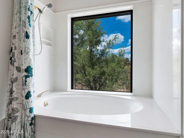 a room with a bed and next to a window