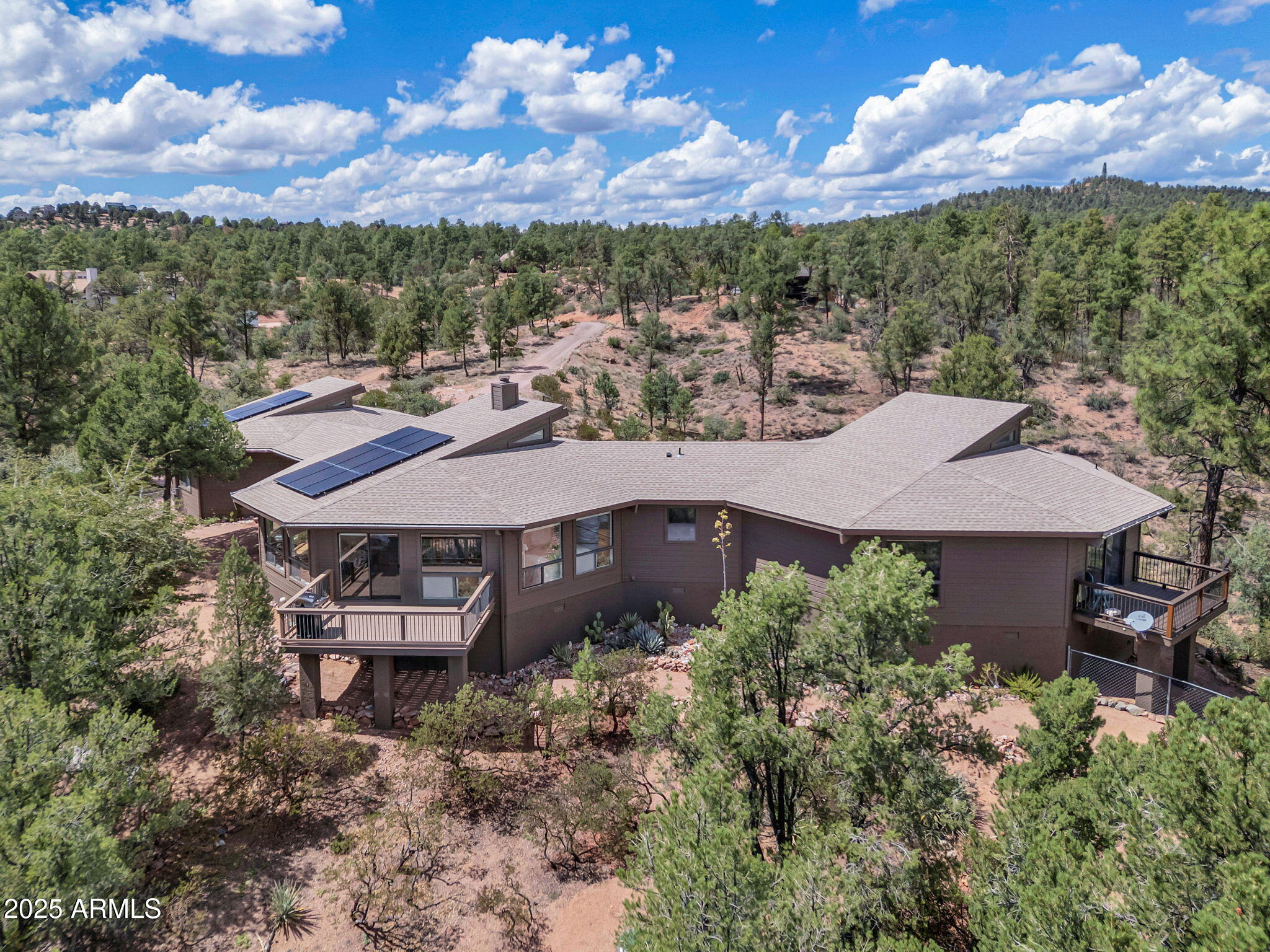 1111 South Sutton Road Payson, AZ 85541 - Photo 49 of 50 an aerial view of a house with a yard table and chairs