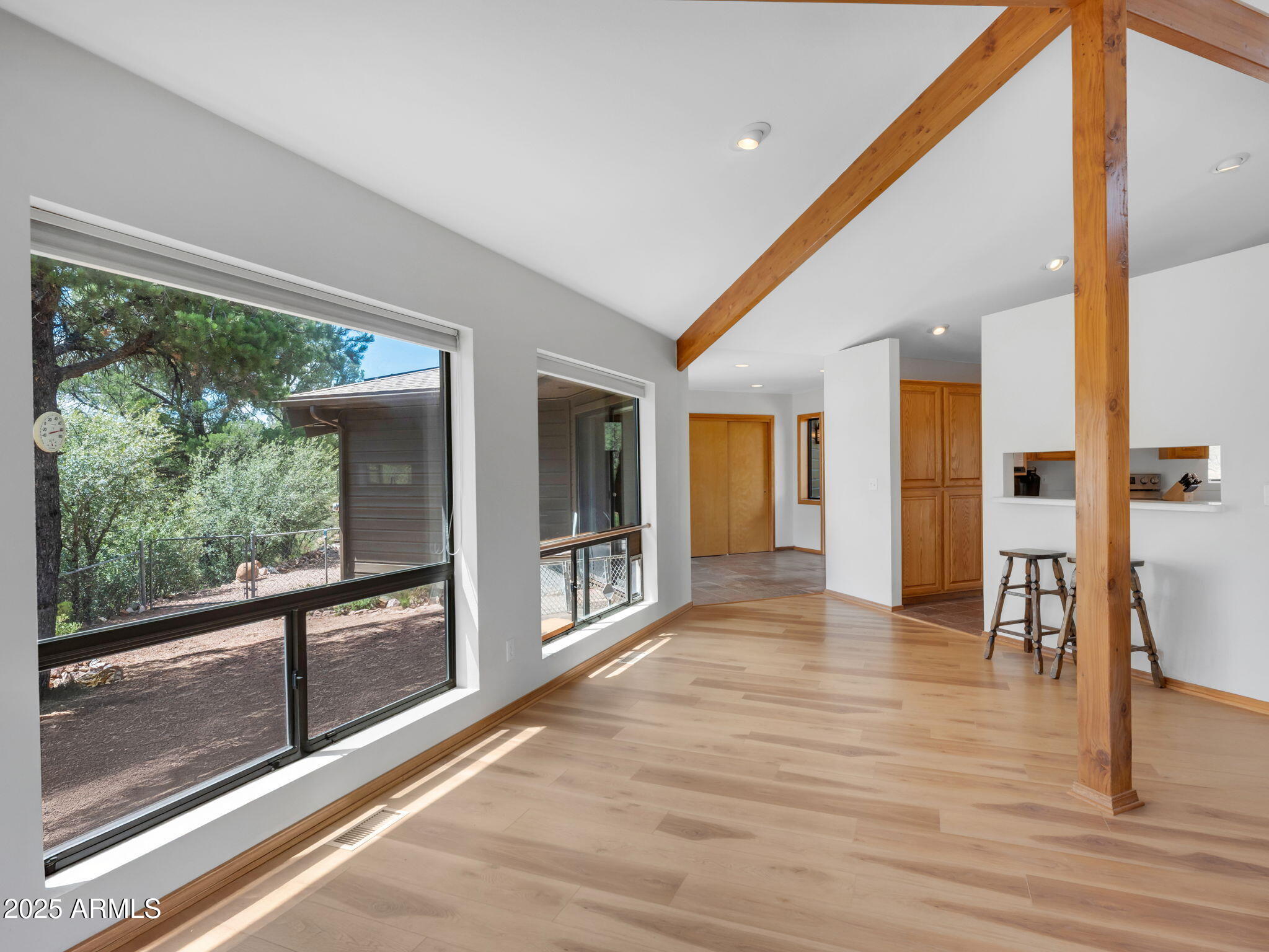 1111 South Sutton Road Payson, AZ 85541 - Photo 8 of 50 a view of a hallway with wooden floor and a floor to ceiling window