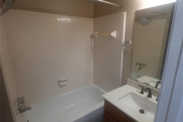 a bathroom with a sink a shower and a mirror