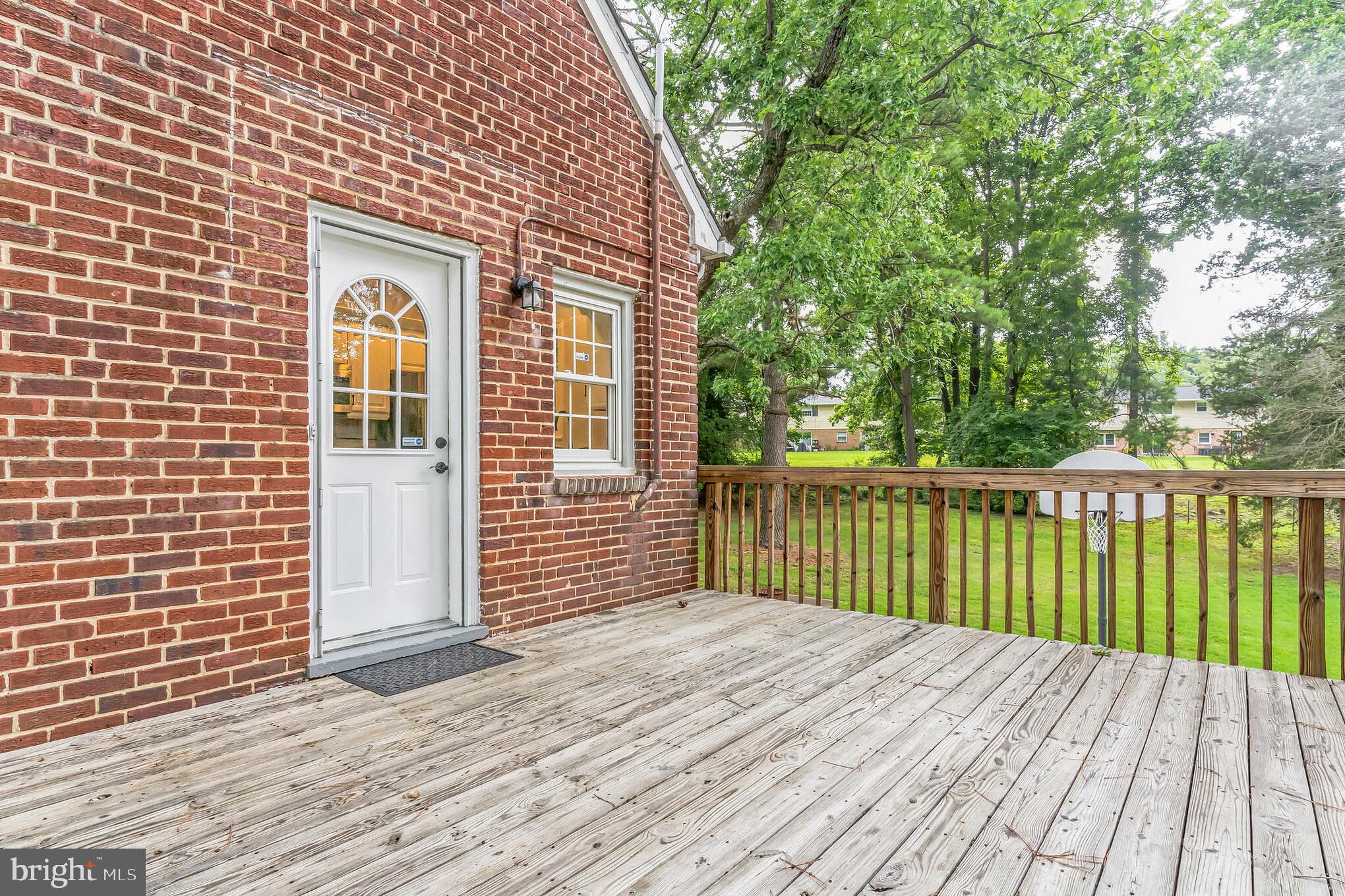 6809 Dodge Lane Temple Hills, MD 20748 - Photo 32 of 47 Deck overlooks the park-like backyard