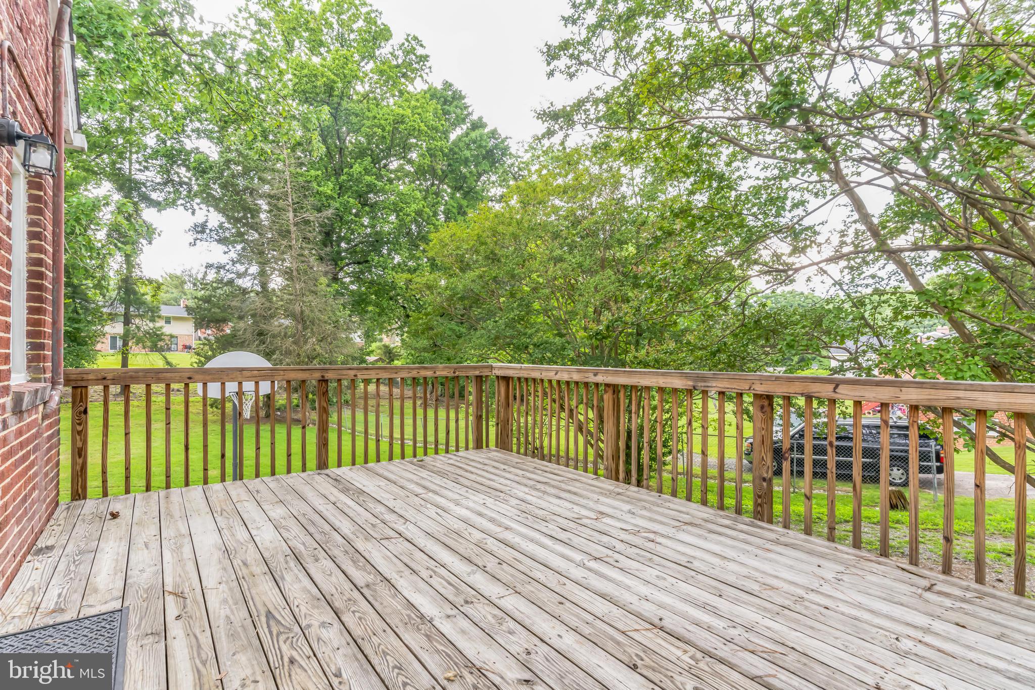 6809 Dodge Lane Temple Hills, MD 20748 - Photo 33 of 47 Deck overlooks the park-like backyard