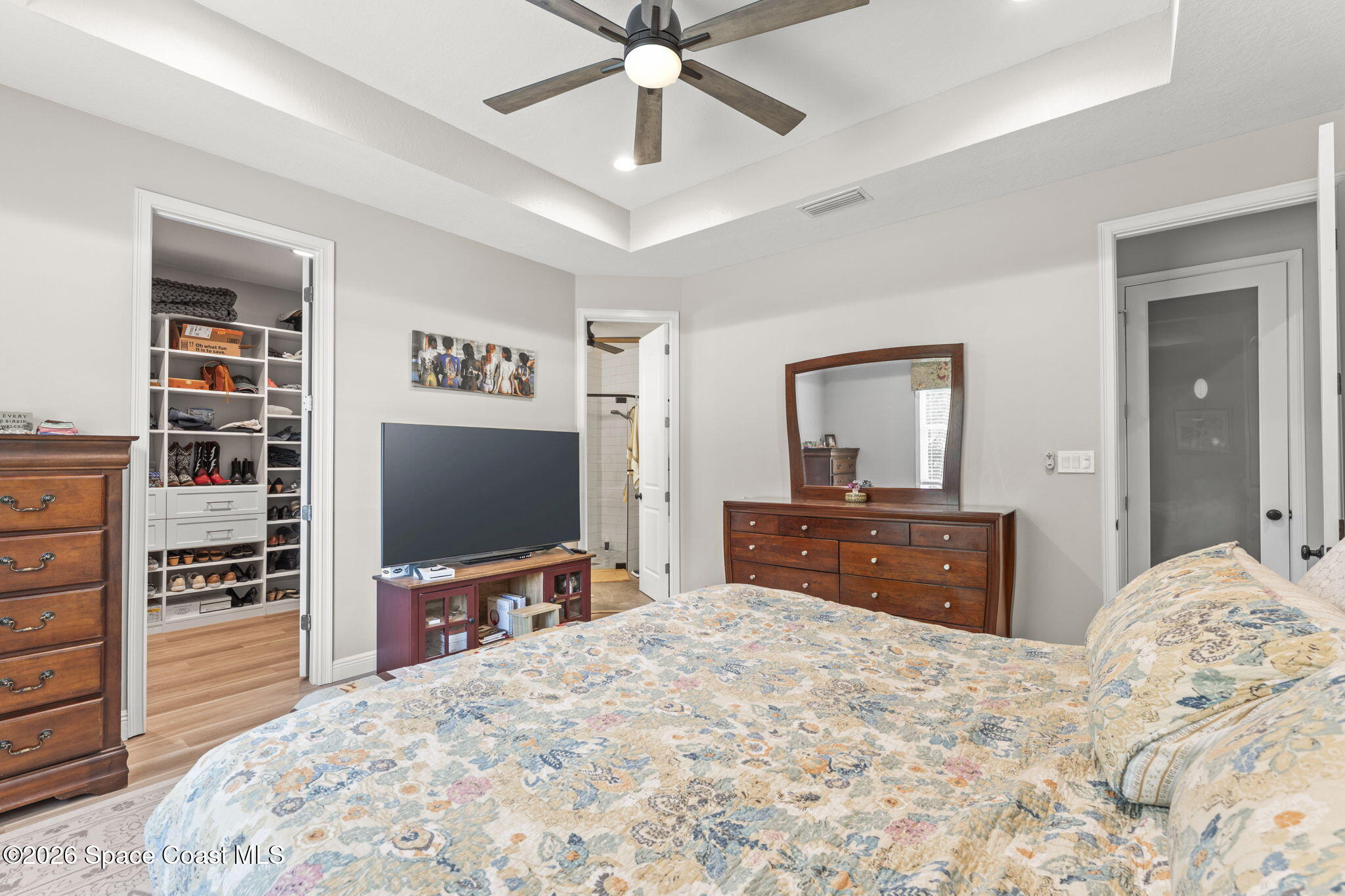 1740 Ford Road Mims, FL 32754 - Photo 21 of 43 a bedroom with a bed and a flat screen tv in it