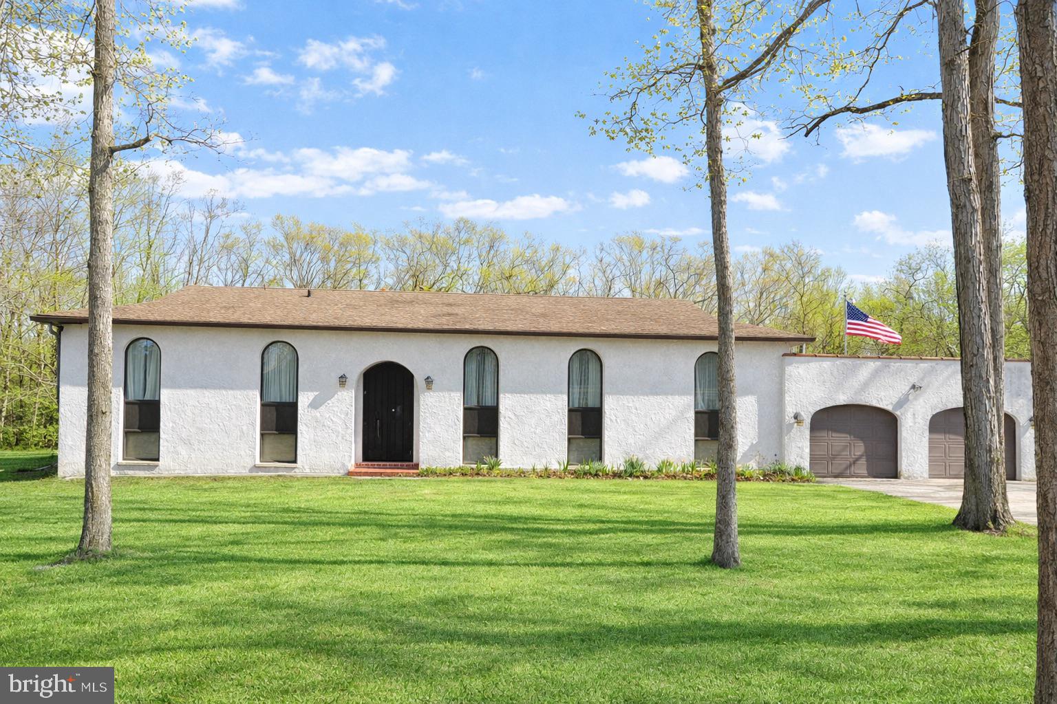 1590 East Elmer Road Vineland, NJ 08361 - Photo 1 of 25 a view of a house with a yard